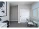 Office space with glass desk, white storage cabinet, and gray carpet at 12495 Point Sierra St, Las Vegas, NV 89138
