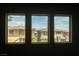 Neighborhood view through three adjacent windows at 12495 Point Sierra St, Las Vegas, NV 89138