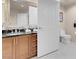 Tastefully designed bathroom featuring double sinks, dark granite counters, and a separate toilet area at 125 E Harmon Ave # 2215, Las Vegas, NV 89109