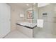 Bathroom featuring a soaking tub, a separate glass shower, and tile flooring at 125 E Harmon Ave # 2215, Las Vegas, NV 89109