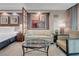 Well-lit bedroom area with couch and city views at 125 E Harmon Ave # 2215, Las Vegas, NV 89109