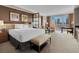 Bright bedroom with neutral colors, king bed, city views, and a convenient desk area at 125 E Harmon Ave # 2215, Las Vegas, NV 89109