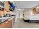 Inviting bedroom with kitchenette featuring granite counters and a wall-mounted TV at 125 E Harmon Ave # 2215, Las Vegas, NV 89109