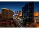 Bustling city view at night with prominent buildings and the glow of Las Vegas, captured from an elevated vantage point at 125 E Harmon Ave # 2215, Las Vegas, NV 89109