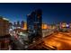 Las Vegas strip with casino lights and cityscape view at night, and active city streets at 125 E Harmon Ave # 2215, Las Vegas, NV 89109