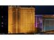 Nighttime shot of the Wynn hotel's detailed exterior, illuminated against the night sky with neighboring buildings at 125 E Harmon Ave # 2215, Las Vegas, NV 89109