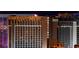 Nighttime view of the Horseshoe Hotel exterior, with illuminated signage and neighboring buildings at 125 E Harmon Ave # 2215, Las Vegas, NV 89109