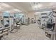 The fitness center is equipped with modern machines, mirrored walls, and carpeted floor at 125 E Harmon Ave # 2215, Las Vegas, NV 89109
