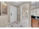 Hallway view towards bathroom with modern design featuring tile floors and stylish decor at 125 E Harmon Ave # 2215, Las Vegas, NV 89109