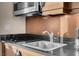Close-up of a kitchenette with modern appliances and stylish countertops at 125 E Harmon Ave # 2215, Las Vegas, NV 89109