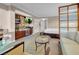 Living room with kitchenette, sofa bed, and a view into the bedroom at 125 E Harmon Ave # 2215, Las Vegas, NV 89109