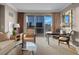 Cozy living room with comfortable seating and large windows with a city view at 125 E Harmon Ave # 2215, Las Vegas, NV 89109