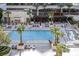 Aerial view of a pool area with cabanas, seating, and palm trees at 125 E Harmon Ave # 2215, Las Vegas, NV 89109