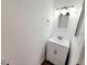 Bathroom vanity with white cabinet, updated sink, and a modern vanity mirror with sleek lighting fixture at 1450 Hialeah Dr # D, Las Vegas, NV 89119
