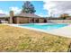Beautiful community pool, clubhouse, mature trees, and lounge seating at 1450 Hialeah Dr # D, Las Vegas, NV 89119