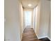 Hallway with wood flooring and access to storage with sliding doors at 1450 Hialeah Dr # D, Las Vegas, NV 89119