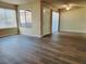 Inviting living room with wood-look flooring, natural light, and front door access at 1450 Hialeah Dr # D, Las Vegas, NV 89119