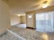 Spacious living room boasts wood-look flooring and modern kitchen access at 1450 Hialeah Dr # D, Las Vegas, NV 89119