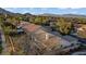 Overhead view showing a home's tile roof in a neighborhood of similar properties with distant mountains at 205 Derwent Pl, Las Vegas, NV 89144