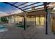 Covered back patio features a built-in grill, outdoor seating, and access to the pool area, perfect for entertaining guests at 205 Derwent Pl, Las Vegas, NV 89144