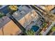 An aerial image shows a backyard pool and well maintained tile roof at 205 Derwent Pl, Las Vegas, NV 89144