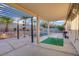 Backyard featuring a covered patio and a swimming pool perfect for outdoor relaxation at 205 Derwent Pl, Las Vegas, NV 89144