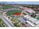 Aerial of baseball field showcasing well-maintained green space and school campus at 205 Derwent Pl, Las Vegas, NV 89144