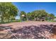 Outdoor basketball court with ample space and shade trees, ideal for recreational play and exercise at 205 Derwent Pl, Las Vegas, NV 89144