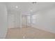 Bedroom with hardwood floors, mirrored closet doors, and a large window at 205 Derwent Pl, Las Vegas, NV 89144
