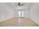 Bedroom features ceiling fan and door to the outside at 205 Derwent Pl, Las Vegas, NV 89144