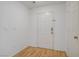 Hallway with a white door and light hardwood floors at 205 Derwent Pl, Las Vegas, NV 89144