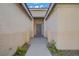 View of the home's entryway and a neutral-colored front door at 205 Derwent Pl, Las Vegas, NV 89144