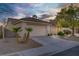 Charming single-story home with a well-maintained front yard and an attached two-car garage at 205 Derwent Pl, Las Vegas, NV 89144