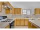 A gas range sits adjacent to a white tile countertop at 205 Derwent Pl, Las Vegas, NV 89144