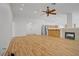 Spacious living room featuring hardwood floors, fireplace, and neutral paint at 205 Derwent Pl, Las Vegas, NV 89144