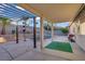 Covered outdoor patio with pool, pergola, and desert landscaping at 205 Derwent Pl, Las Vegas, NV 89144