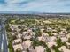 Wide aerial perspective of 2050 Warm Springs Road Unit 1822 nestled in a community with lush landscaping and distant mountains at 2050 W Warm Springs Rd # 1822, Henderson, NV 89014