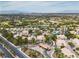 An aerial view of the community featuring lush greenery, desert landscaping, golf course, and mountain views at 2050 W Warm Springs Rd # 1822, Henderson, NV 89014