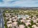 Aerial view of 2050 Warm Springs Road Unit 1822 in a well-maintained community with greenery and city views at 2050 W Warm Springs Rd # 1822, Henderson, NV 89014