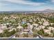 An aerial view of the community featuring lush greenery and desert landscaping with mountain views at 2050 W Warm Springs Rd # 1822, Henderson, NV 89014