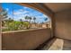Outdoor balcony with desert landscape views, stucco walls and tiled floor at 2050 W Warm Springs Rd # 1822, Henderson, NV 89014