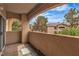 Outdoor balcony with desert landscape views, stucco walls and tiled floor at 2050 W Warm Springs Rd # 1822, Henderson, NV 89014