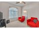 Bedroom with neutral carpet and two red chairs at 2050 W Warm Springs Rd # 1822, Henderson, NV 89014