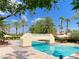 Inviting community pool area with a bridge, lounge seating, and manicured landscaping, perfect for relaxation at 2050 W Warm Springs Rd # 1822, Henderson, NV 89014