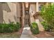Inviting townhouse entrance with well-manicured landscaping and a desert color palette at 2050 W Warm Springs Rd # 1822, Henderson, NV 89014