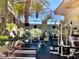 Well-equipped community gym features modern cardio and weight machines with views of the outdoor landscape at 2050 W Warm Springs Rd # 1822, Henderson, NV 89014