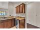 Charming kitchen showcasing granite countertops, stainless steel dishwasher, and wood cabinetry at 2050 W Warm Springs Rd # 1822, Henderson, NV 89014