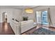 Bright living room features fireplace, white sofa, dark floors, and sliding glass door to patio at 2050 W Warm Springs Rd # 1822, Henderson, NV 89014