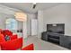 Comfortable living room featuring modern furniture, a large TV, and bright lighting at 2050 W Warm Springs Rd # 1822, Henderson, NV 89014