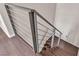 Modern staircase with dark wood steps, and a metal handrail at 2050 W Warm Springs Rd # 1822, Henderson, NV 89014